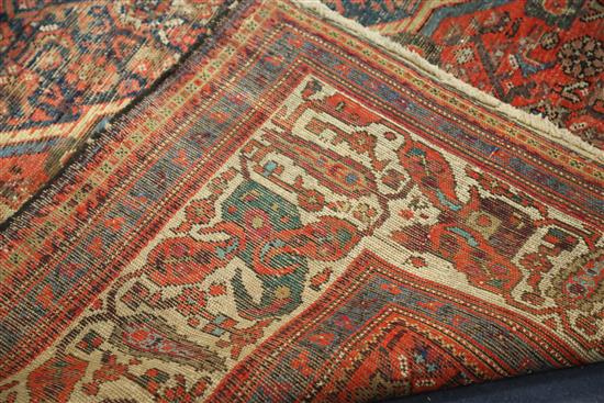 An antique Malayer carpet, dated 1905, 14ft 3in by 10ft 4in.